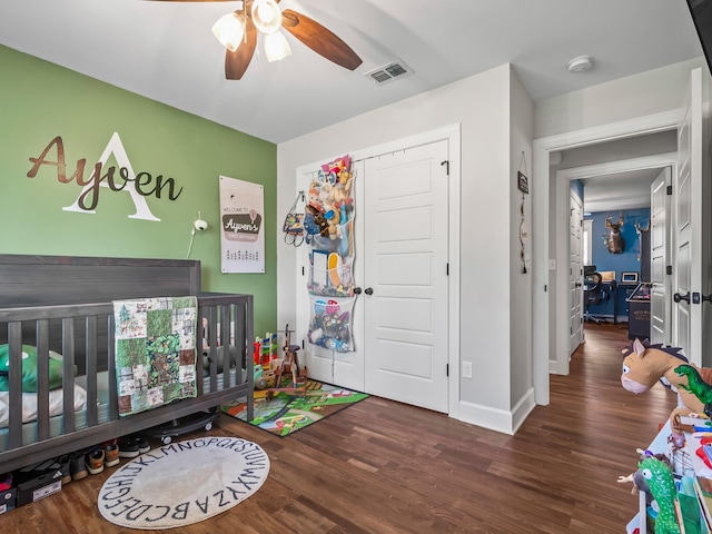 103 Pan Cera Dr, Crawfordville, FL 32327 - bedroom with wood finished floors, a nursery area, ceiling fan, and a closet