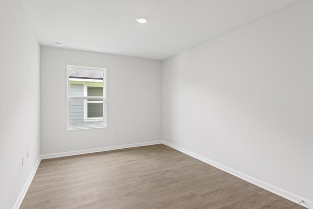 spare room featuring light hardwood / wood-style floors