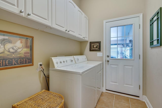 2605 Antietam Trl, Tallahassee, FL 32312 - washroom with washer and dryer, cabinet space, light tile patterned floors, and baseboards