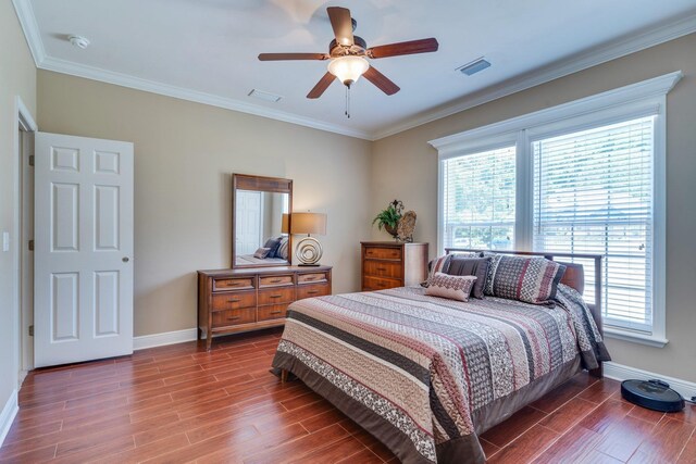 2605 Antietam Trl, Tallahassee, FL 32312 - bedroom featuring baseboards, wood finished floors, crown molding, and a ceiling fan