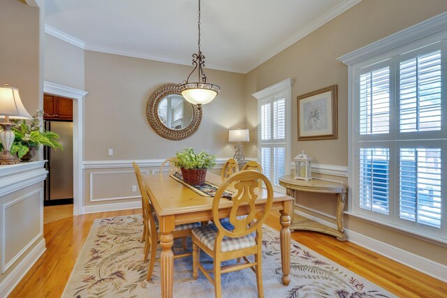 2605 Antietam Trl, Tallahassee, FL 32312 - dining room with light wood finished floors, ornamental molding, and a wainscoted wall