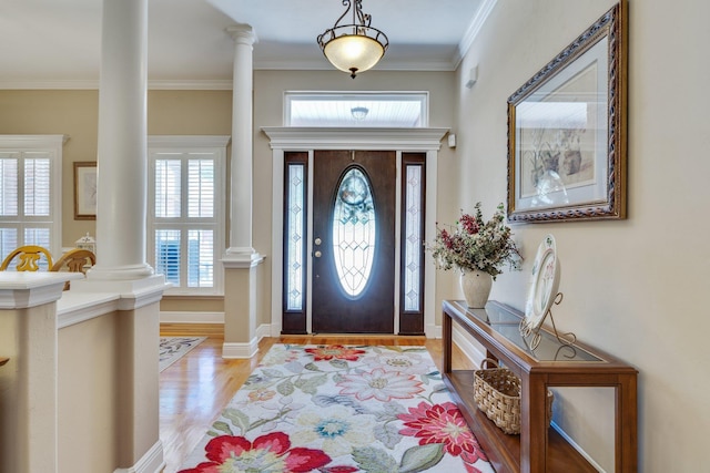 2605 Antietam Trl, Tallahassee, FL 32312 - foyer featuring decorative columns, light wood-style flooring, ornamental molding, and baseboards