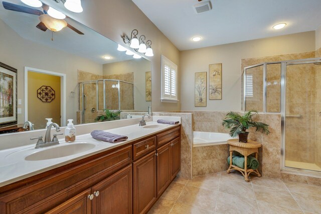 2605 Antietam Trl, Tallahassee, FL 32312 - bathroom featuring a stall shower, tile patterned flooring, a garden tub, a ceiling fan, and double vanity