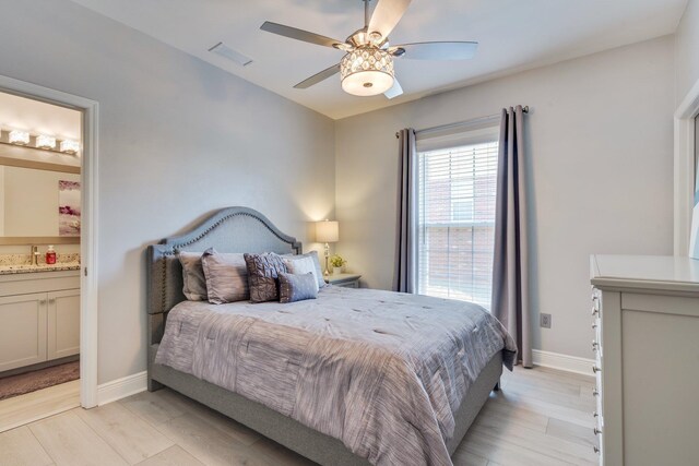 2605 Antietam Trl, Tallahassee, FL 32312 - bedroom with ensuite bath, baseboards, light wood finished floors, and a ceiling fan