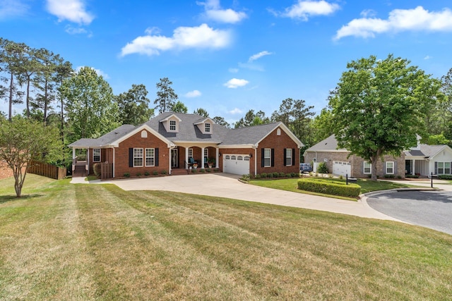 2605 Antietam Trl, Tallahassee, FL 32312 - view of front of property featuring brick siding, driveway, a front yard, an attached garage, and roof with shingles