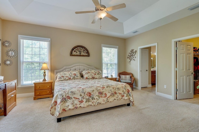 2605 Antietam Trl, Tallahassee, FL 32312 - bedroom featuring a raised ceiling, light carpet, and multiple windows