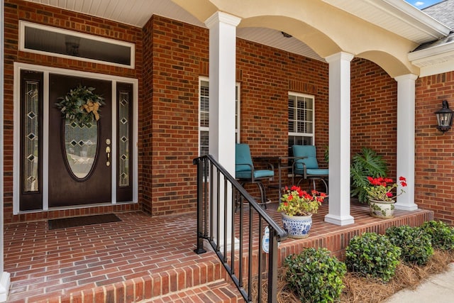 2605 Antietam Trl, Tallahassee, FL 32312 - view of exterior entry featuring covered porch and brick siding
