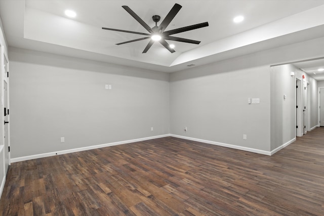 empty room with dark wood-style floors, baseboards, lofted ceiling, recessed lighting, and ceiling fan