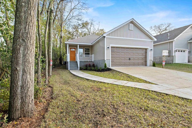 view of front of house featuring board and batten siding, a front lawn, concrete driveway, covered porch, and an attached garage