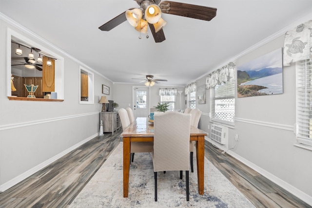 dining area featuring a wall unit AC, hardwood / wood-style floors, and ornamental molding