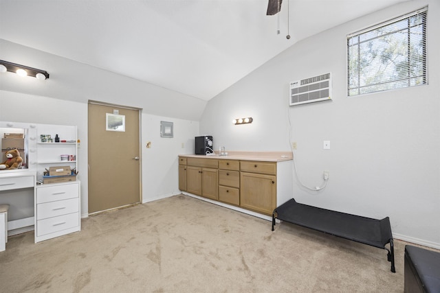 bathroom featuring an AC wall unit, ceiling fan, and lofted ceiling