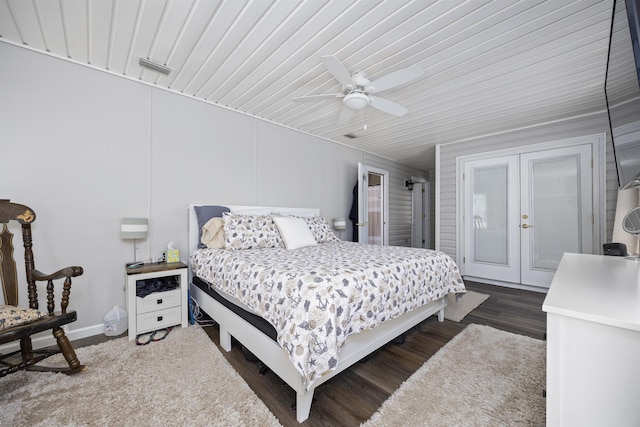 bedroom featuring ceiling fan, dark hardwood / wood-style flooring, and french doors