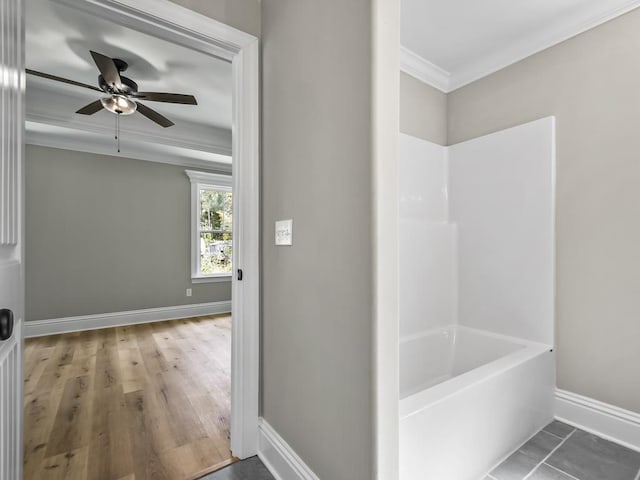 bathroom featuring ceiling fan, ornamental molding, and shower with separate bathtub