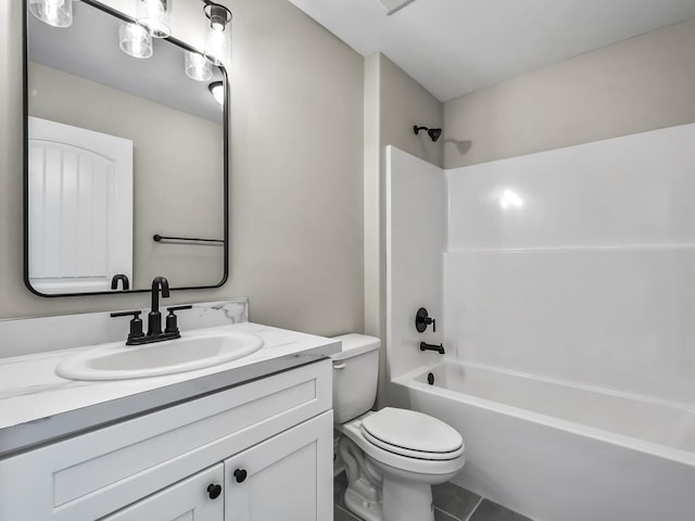 full bathroom featuring tile patterned flooring, shower / tub combination, vanity, and toilet