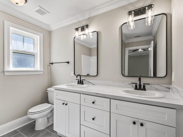 bathroom with tile patterned flooring, vanity, toilet, and ornamental molding