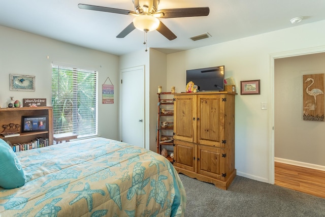 627 Mariner Cir, Alligator Point, FL 32346 - carpeted bedroom with baseboards and ceiling fan