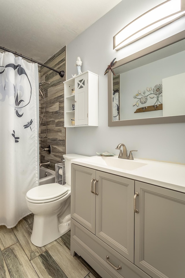 627 Mariner Cir, Alligator Point, FL 32346 - bathroom featuring vanity, toilet, wood finished floors, and shower / bath combination with curtain