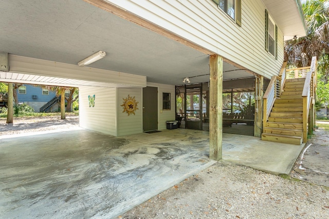 627 Mariner Cir, Alligator Point, FL 32346 - view of patio featuring stairs and an attached carport