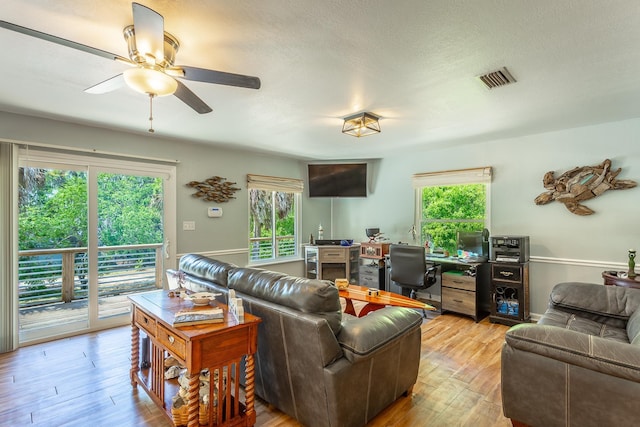 627 Mariner Cir, Alligator Point, FL 32346 - living room featuring a desk, healthy amount of natural light, ceiling fan, and light wood-type flooring