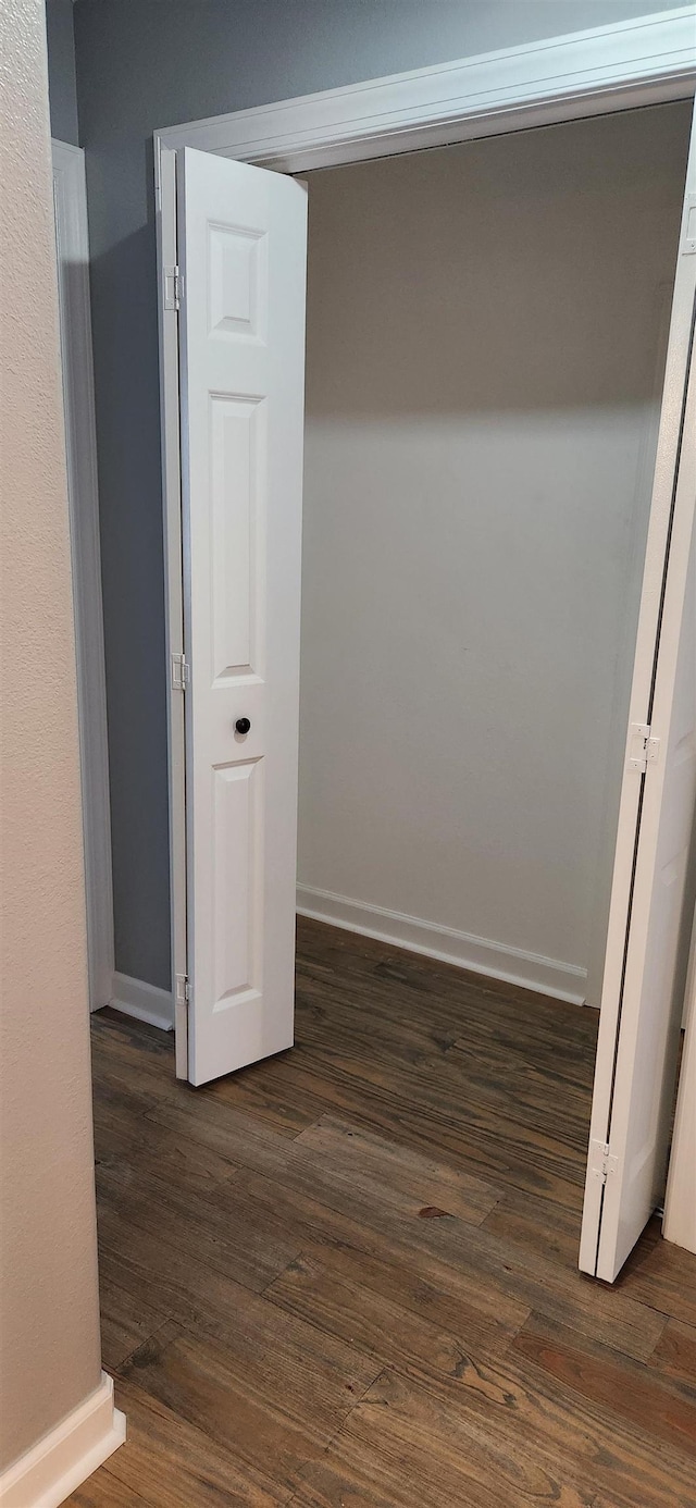 hall with dark hardwood / wood-style floors