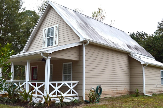 view of side of property featuring a porch