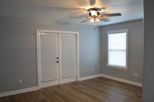 interior space with ceiling fan, dark wood-type flooring, and a closet