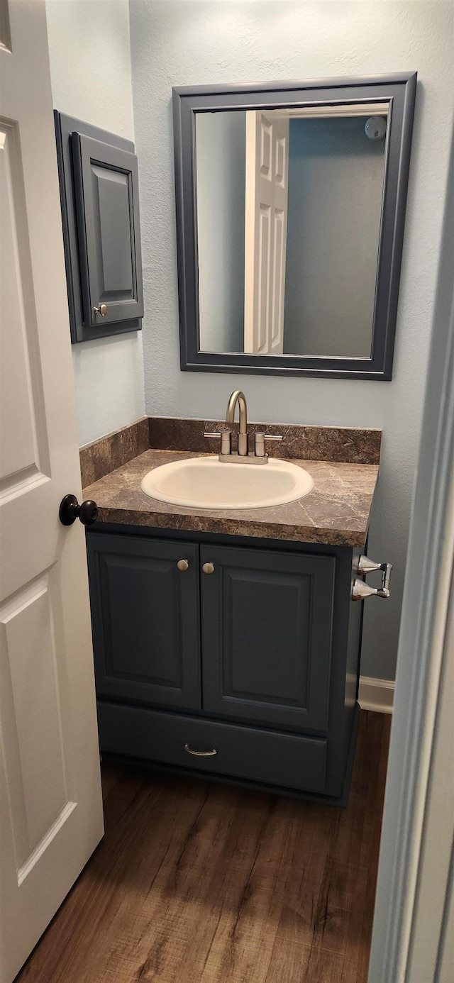 bathroom featuring vanity and hardwood / wood-style flooring