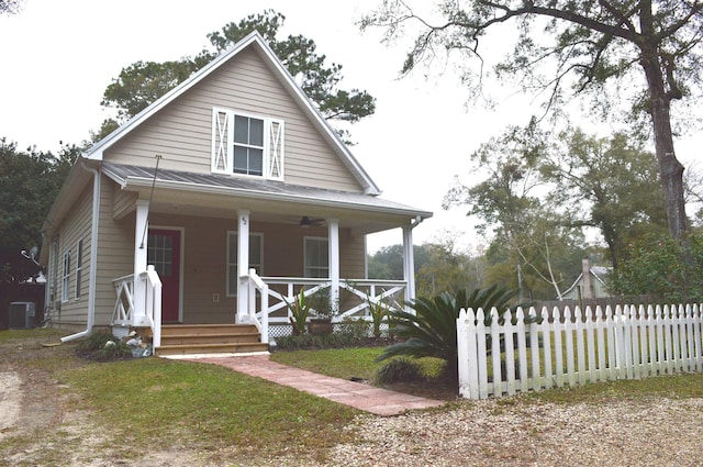 view of front of home with a porch and cooling unit