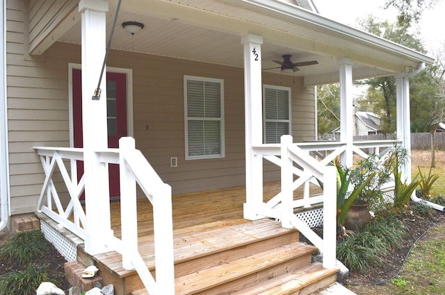 deck with ceiling fan and covered porch