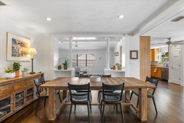 dining room featuring visible vents, dark wood-style flooring, decorative columns, and a ceiling fan