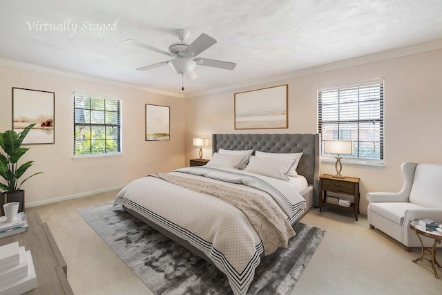 bedroom featuring light carpet, ornamental molding, a ceiling fan, and baseboards