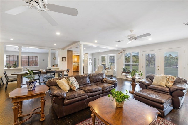 living area featuring ceiling fan, recessed lighting, dark wood-type flooring, french doors, and ornate columns