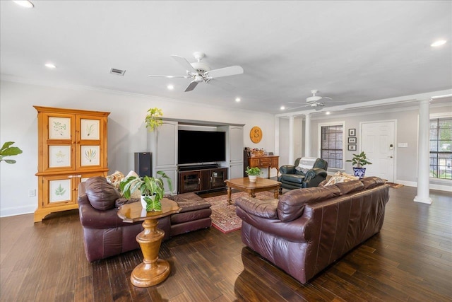 living area featuring ceiling fan, dark wood finished floors, and ornate columns