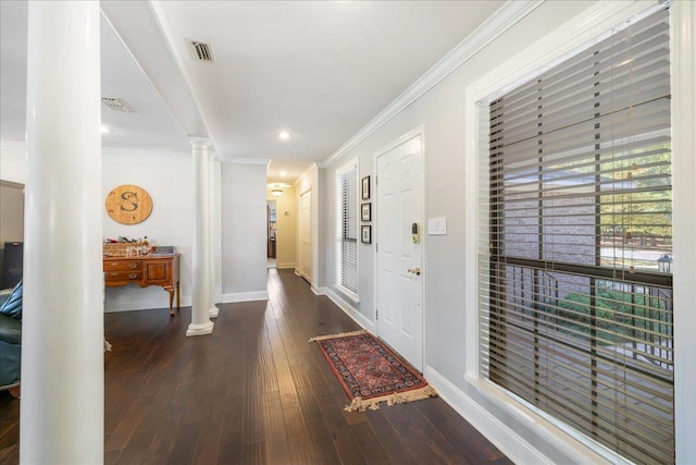 entrance foyer with baseboards, ornamental molding, dark wood-style flooring, and ornate columns