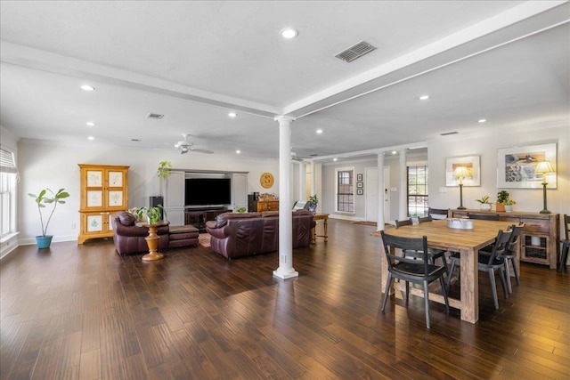 dining area featuring recessed lighting, dark wood-style flooring, a ceiling fan, visible vents, and ornate columns