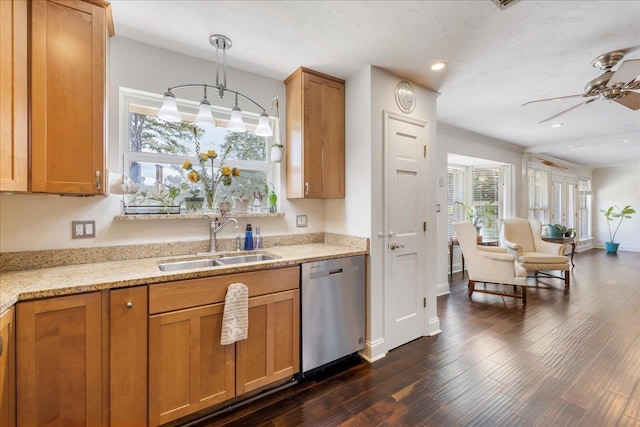 kitchen with ceiling fan, dark wood-type flooring, decorative light fixtures, stainless steel dishwasher, and a sink