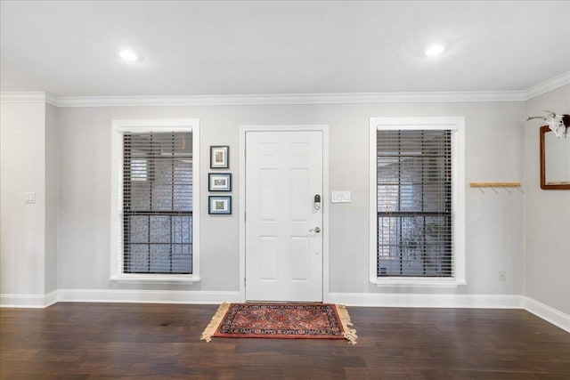 foyer entrance with baseboards, dark wood finished floors, crown molding, and recessed lighting