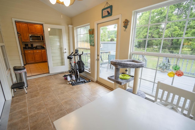 3204 Gallant Fox Trl, Tallahassee, FL 32309 - workout area featuring lofted ceiling, a ceiling fan, and light tile patterned floors
