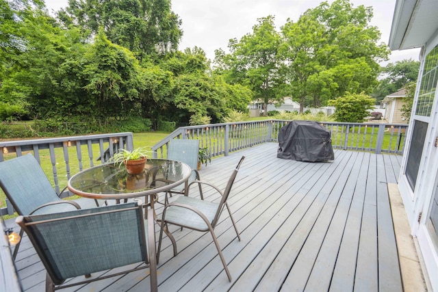 3204 Gallant Fox Trl, Tallahassee, FL 32309 - deck featuring outdoor dining area, a lawn, and view of scattered trees