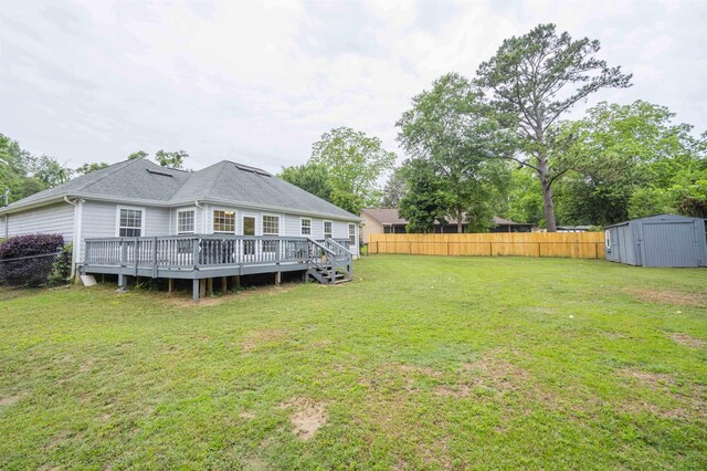3204 Gallant Fox Trl, Tallahassee, FL 32309 - view of yard with a storage unit, a deck, and an outdoor structure