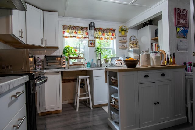 kitchen featuring black electric range oven, white cabinets, exhaust hood, and dark hardwood / wood-style floors