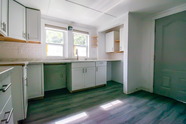 kitchen featuring white cabinetry, sink, and light hardwood / wood-style flooring