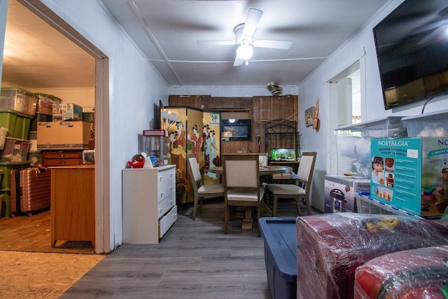 interior space with ceiling fan and wood-type flooring