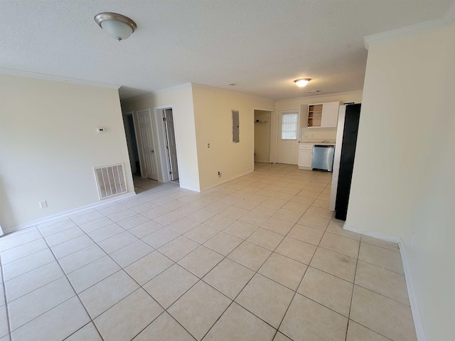 unfurnished living room featuring light tile patterned floors, a textured ceiling, and electric panel