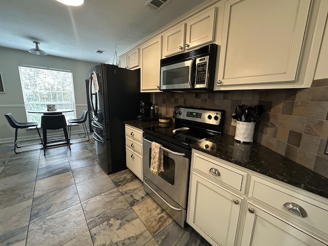 2224 Glenwood Ln, Tallahassee, FL 32308 - kitchen with stainless steel appliances, backsplash, and dark stone counters