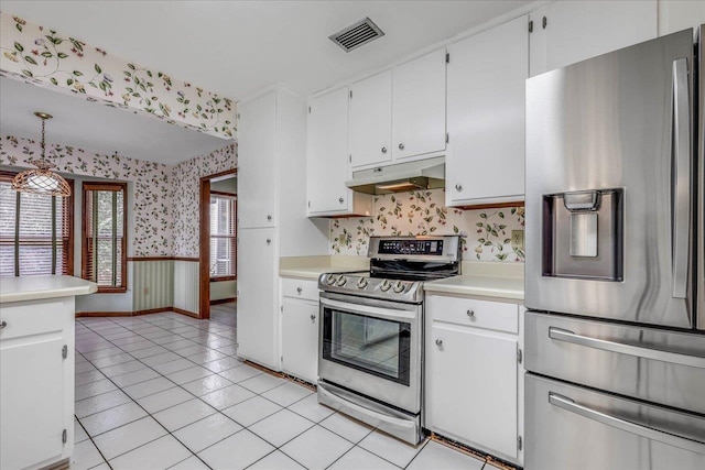 kitchen featuring wallpapered walls, visible vents, appliances with stainless steel finishes, light countertops, and under cabinet range hood