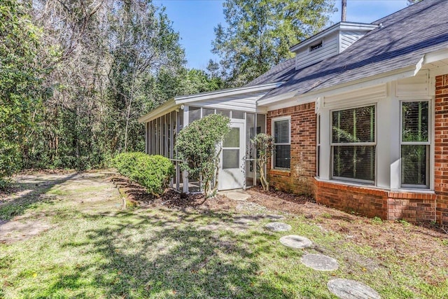 view of yard with a sunroom