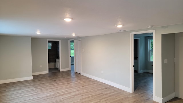 spare room featuring light hardwood / wood-style floors