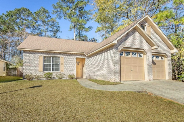 view of front of house featuring a garage and a front lawn