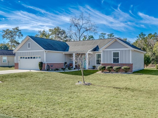 single story home featuring a front yard, concrete driveway, a garage, and board and batten siding